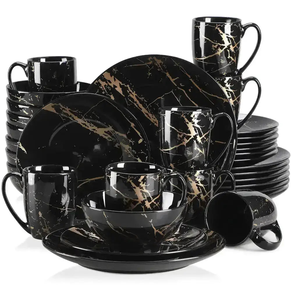 Svart dinnerware set med guldmarblemönster från DARNI Servis 32 delar