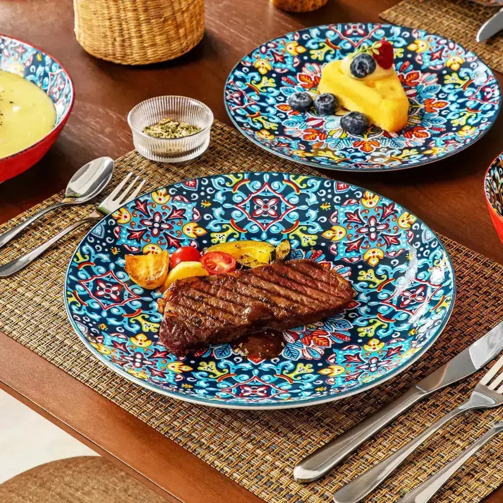 HERMES servis rund tallrik med färgstark blå, gul och röd floral och geometrisk design